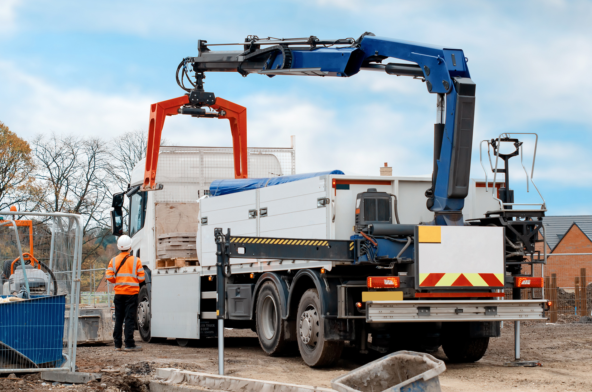 Dropside flatbed HIAB crane lorry with brick grab attachment